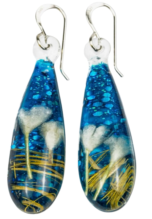 Handmade botanical dichroic glass drop earrings 2.1 inches long with real dried grass straws suspended in blue glass on sterling silver ear wires