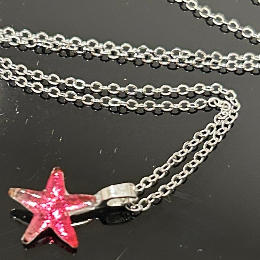 Handmade dichroic glass starfish pendant 1 inch with color-shifting pink effects on 21 inch sterling silver chain