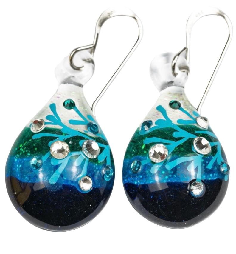 Pair of 1.125 inch handmade glass drop earrings with color gradient from cream to turquoise to deep blue, embedded crystal details, and sterling silver hooks