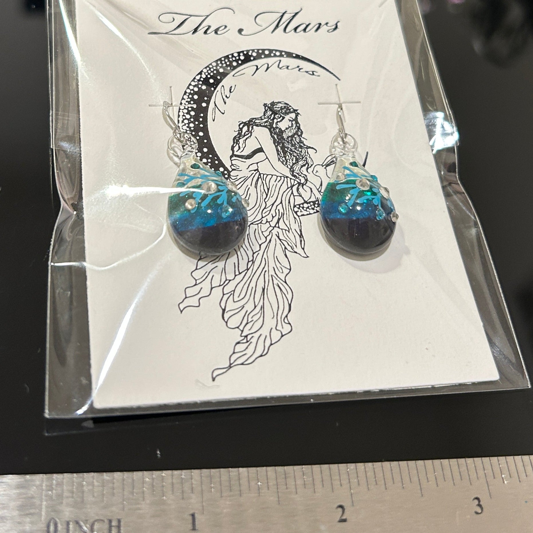 Pair of 1.125 inch handmade glass drop earrings with color gradient from cream to turquoise to deep blue, embedded crystal details, and sterling silver hooks