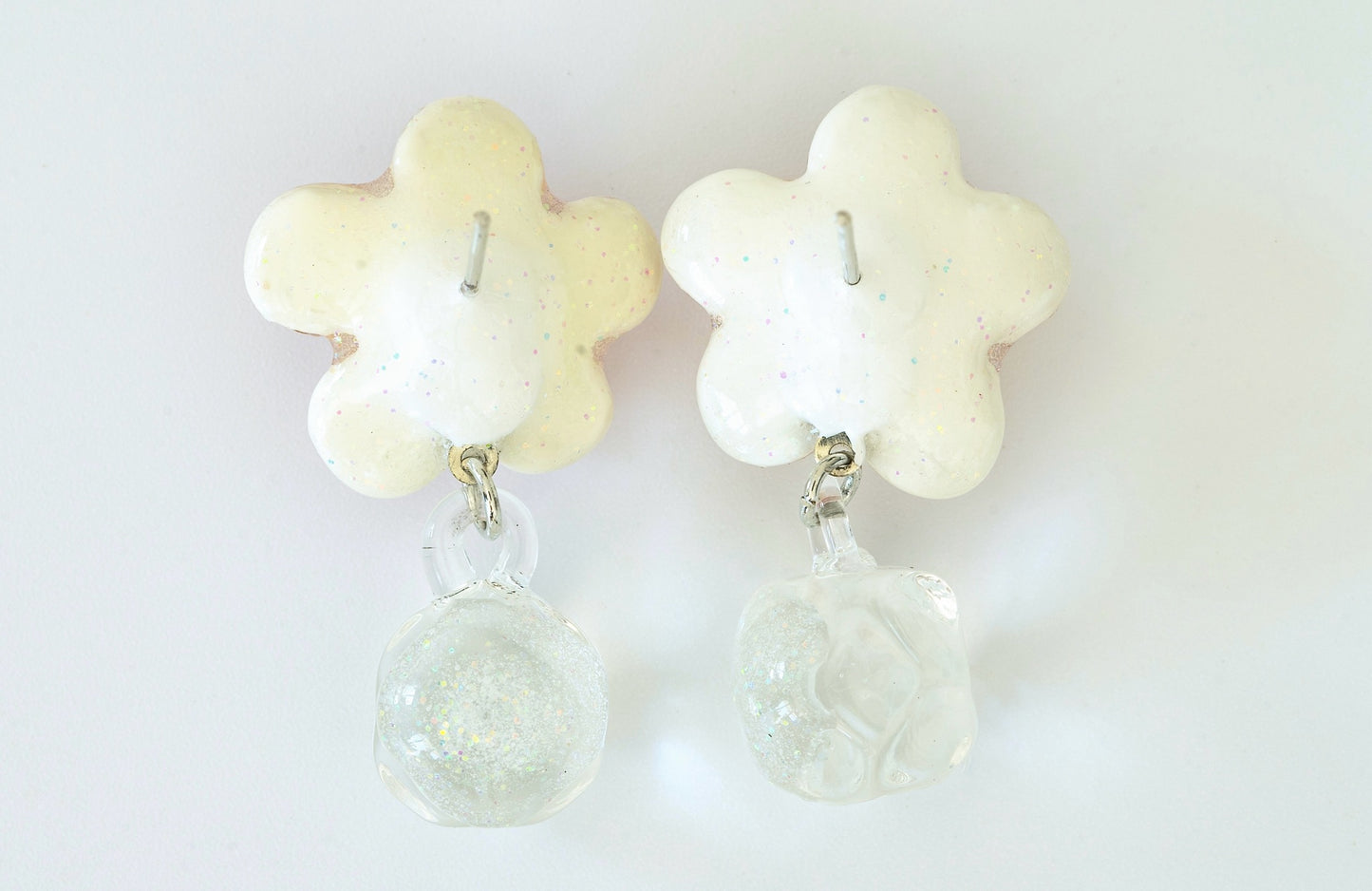 Pair of handmade pink dichroic glass flower stud earrings with pearl centers and dangling crystal balls sterling silver posts butterfly backs artisan jewelry