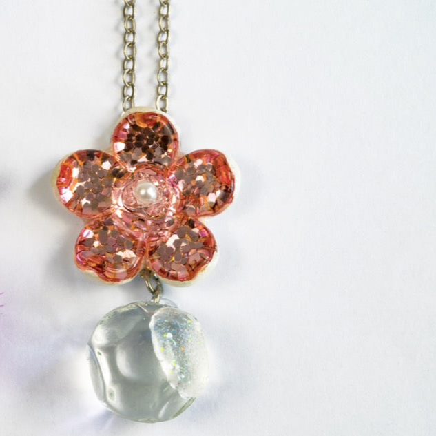 Handmade pink flower dichroic glass pendant with crystal ball drop. 1 inch flower, 1.5 inch total. Pearl center. 21" sterling silver chain included. Ships from Oregon.