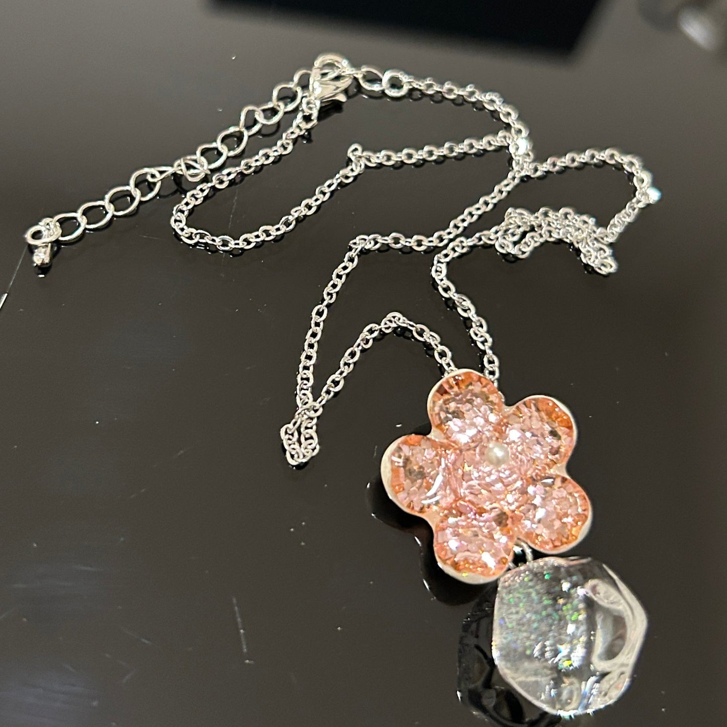 Handmade pink flower dichroic glass pendant with crystal ball drop. 1 inch flower, 1.5 inch total. Pearl center. 21" sterling silver chain included. Ships from Oregon.