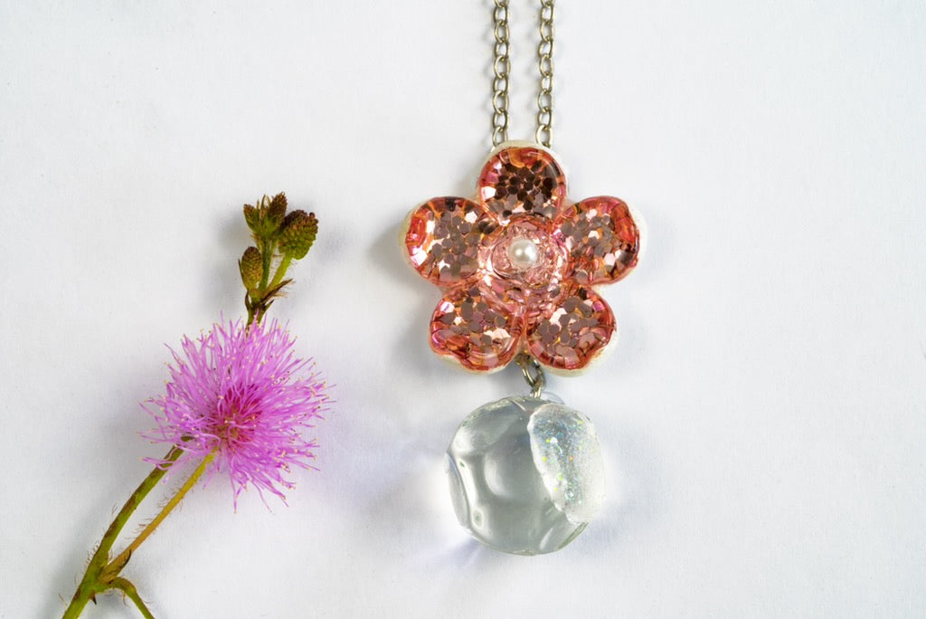 Handmade pink flower dichroic glass pendant with crystal ball drop. 1 inch flower, 1.5 inch total. Pearl center. 21" sterling silver chain included. Ships from Oregon.